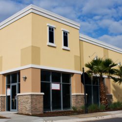 newly constructed home with stone accents on columns
